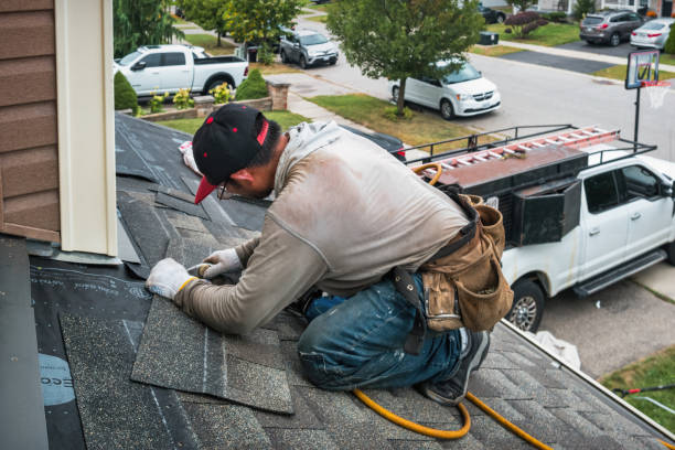 Professional Roofing technician working in Tuscola, IL